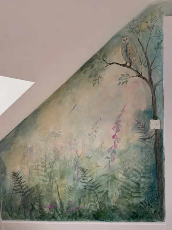 Botanical mural painted by Vera Hylands in a Belfast home — barn owl above ferns and foxgloves, translucent dreamy layers