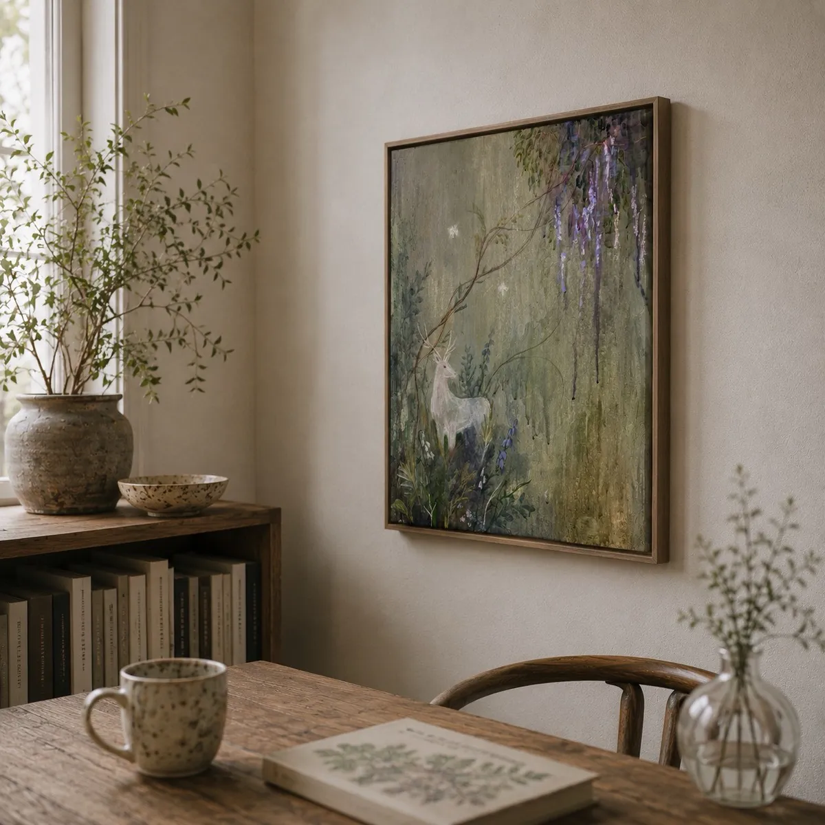 White Stag framed in a warm wooden frame, hung above a wooden console table in a softly-lit dining nook